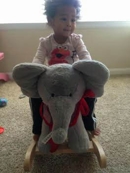 Gabby on her new rocking elephant