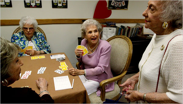 Georgia Scott, 99, center, during a game of bridge at her retirement community. “It’s what keeps us going,” she says. (Sandy Huffaker for the New York Times)