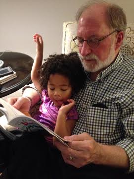 Pops and Gabby reading "Pete the Cat at the Beach."