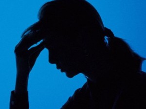 Silhouette of woman holding her head(Photo: Getty Images )