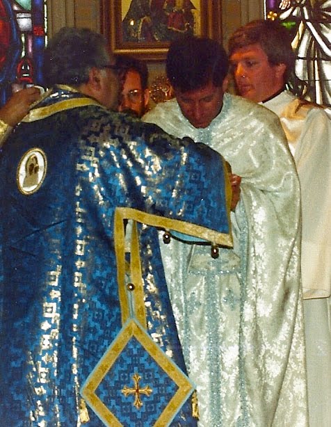 Bishop Antoun (left) and Father John Troy Mashburn (right) help Father Basil Cushman at his ordination on March 15, 1987.