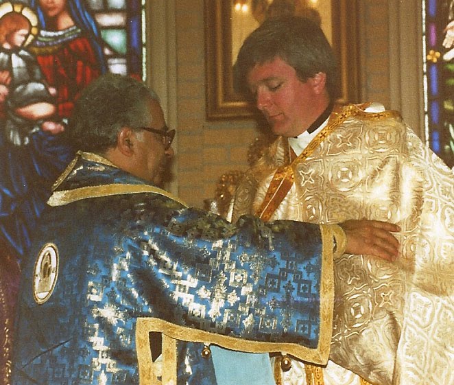 Bishop Antoun assists Father John Troy Mashburn during his ordination, March 15, 1987.