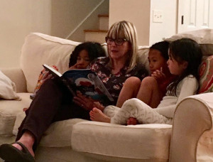 reading to my three oldest granddaughters at the beach last month