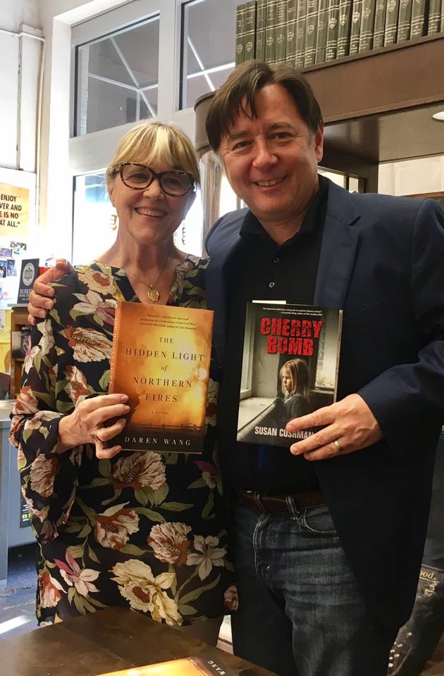 Exchanging first novels with Daren Wang at Burke's Books in Memphis on September 20.