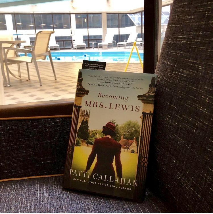 Reading Becoming Mrs. Lewis in my hotel room in Nashville, with the indoor pool outside my window!